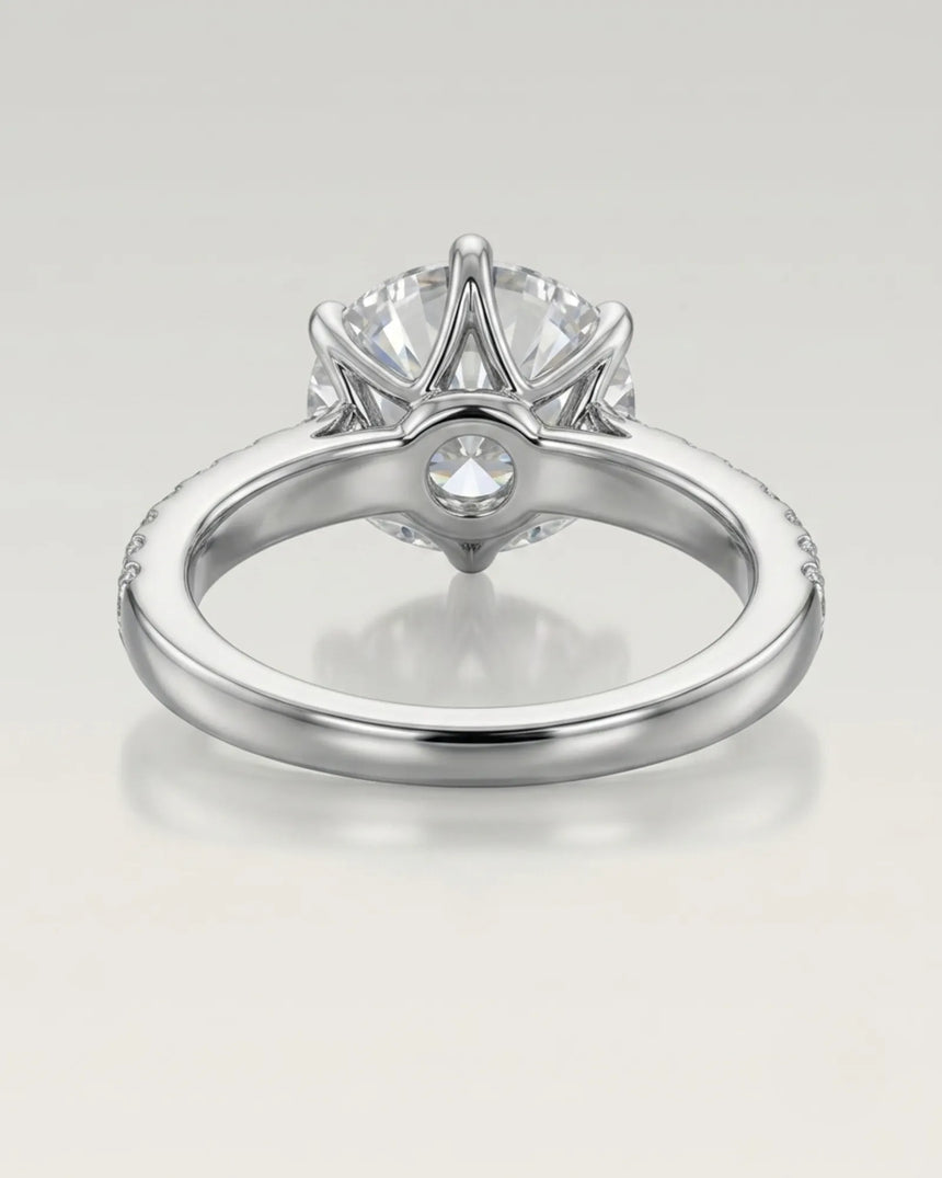 Luxury round moissanite ring with pavé shoulders and enduring platinum setting - SARATTI
