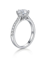 Luxury round moissanite ring with pavé shoulders and refined white gold setting - SARATTI