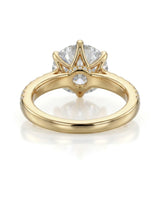 Luxury round moissanite ring with pavé shoulders and rich yellow gold setting - SARATTI