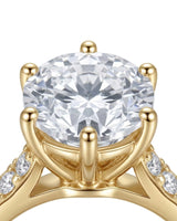 Luxury round moissanite ring with pavé shoulders and rich yellow gold setting | SARATTI