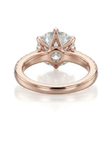 Luxury round moissanite ring with pavé shoulders and warm rose gold setting - SARATTI