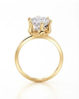 Luxury round moissanite solitaire in 18K yellow gold with refined architectural setting | SARATTI