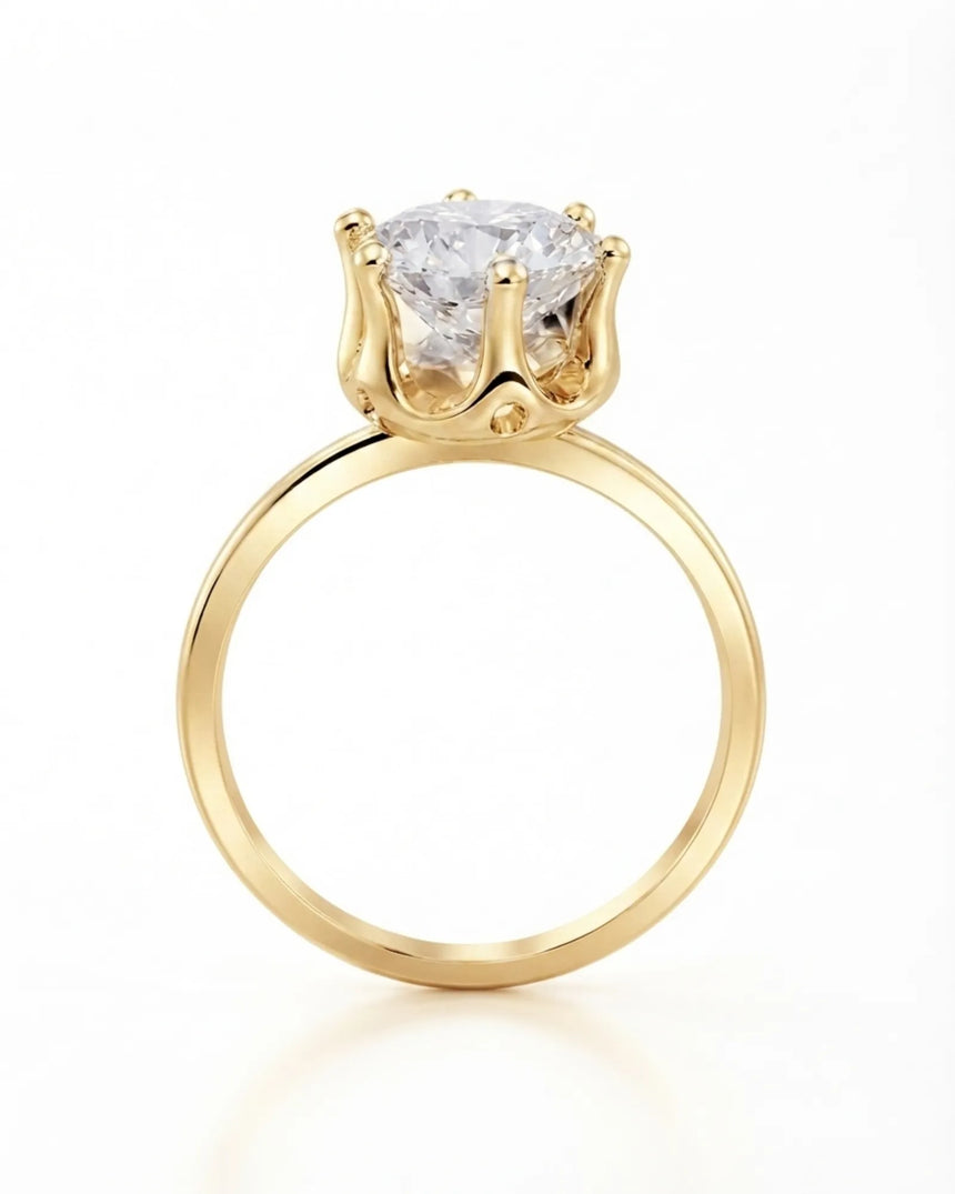 Luxury round moissanite solitaire in 18K yellow gold with refined architectural setting | SARATTI