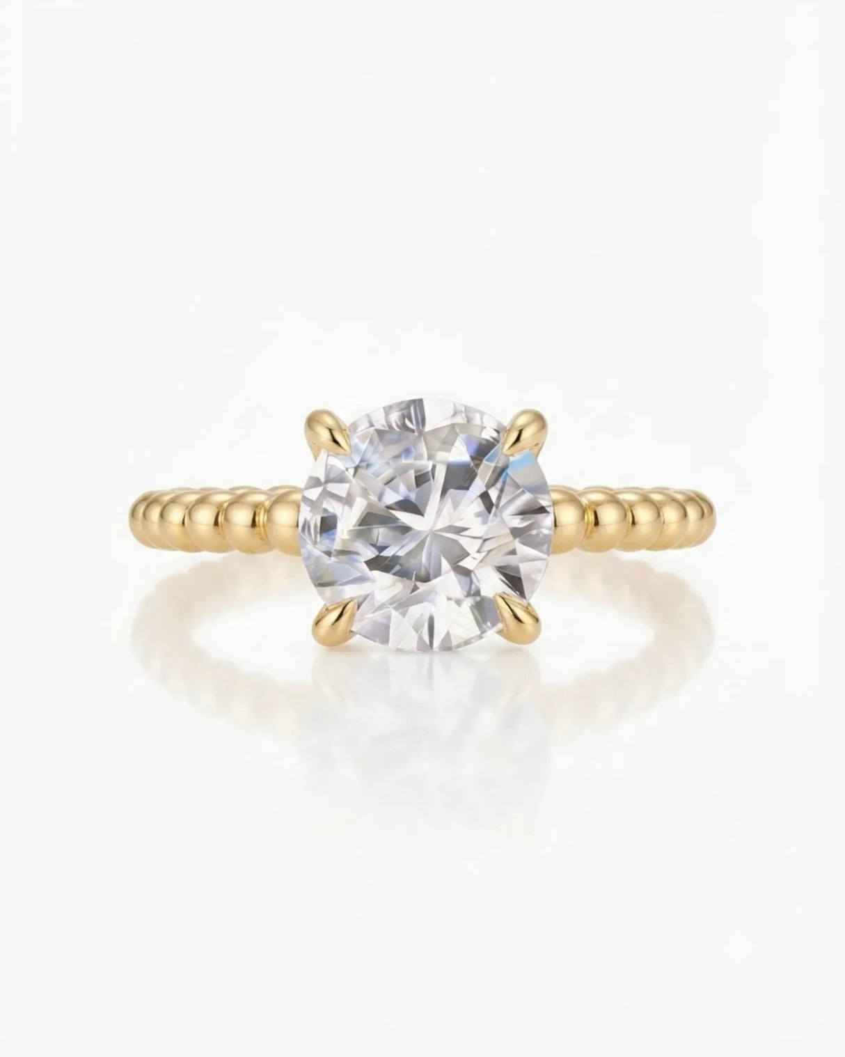 Luxury round moissanite solitaire in yellow gold with continuous polished bead band design | SARATTI.