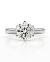 Luxury round moissanite solitaire ring in platinum for premium engagement styling | SARATTI.