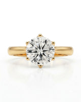 Luxury round moissanite solitaire ring in yellow gold for elegant engagement styling | SARATTI.