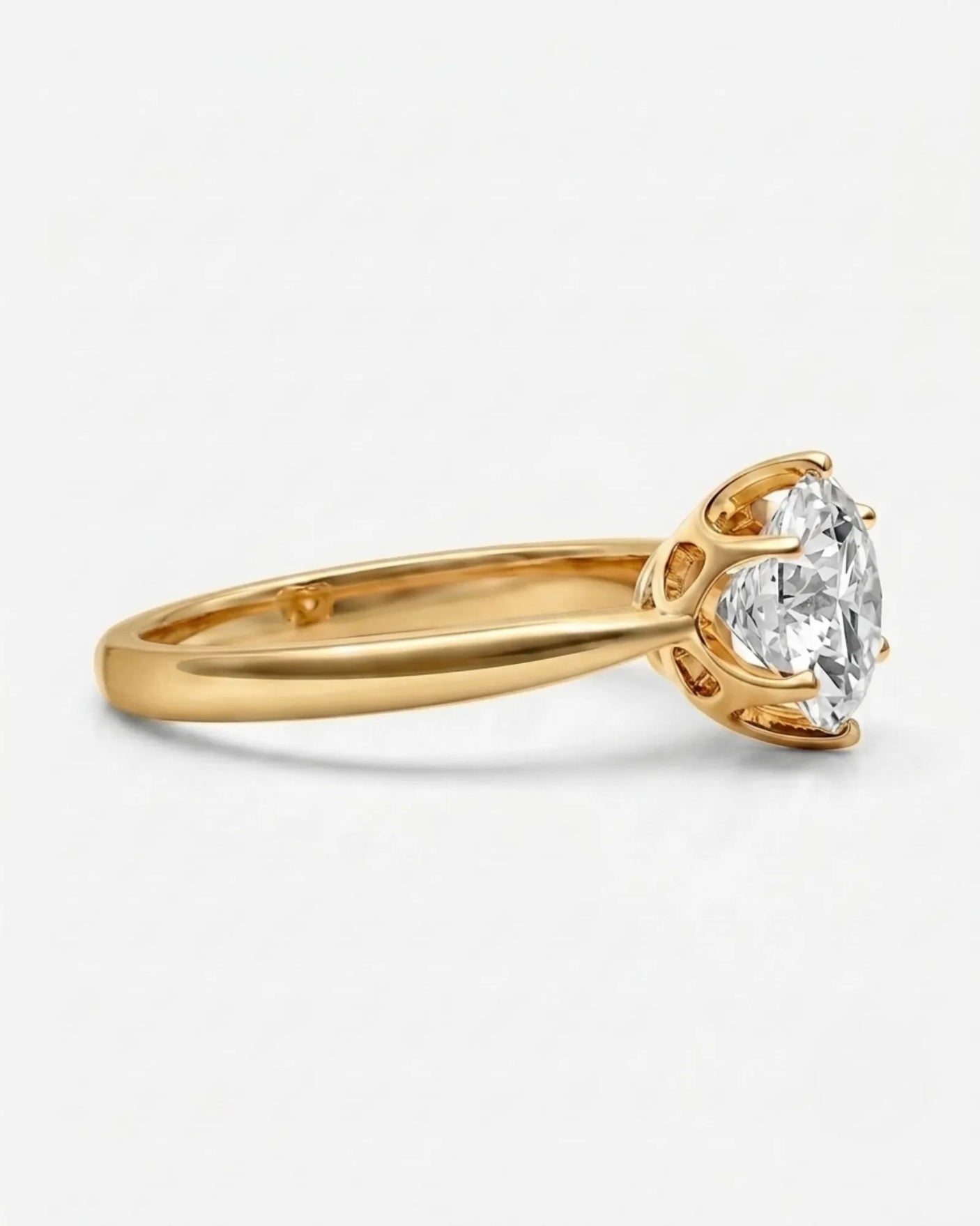 Luxury round moissanite solitaire ring in yellow gold for elegant engagement styling | SARATTI