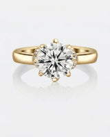 Luxury round moissanite solitaire with vintage yellow gold basket and refined profile | SARATTI