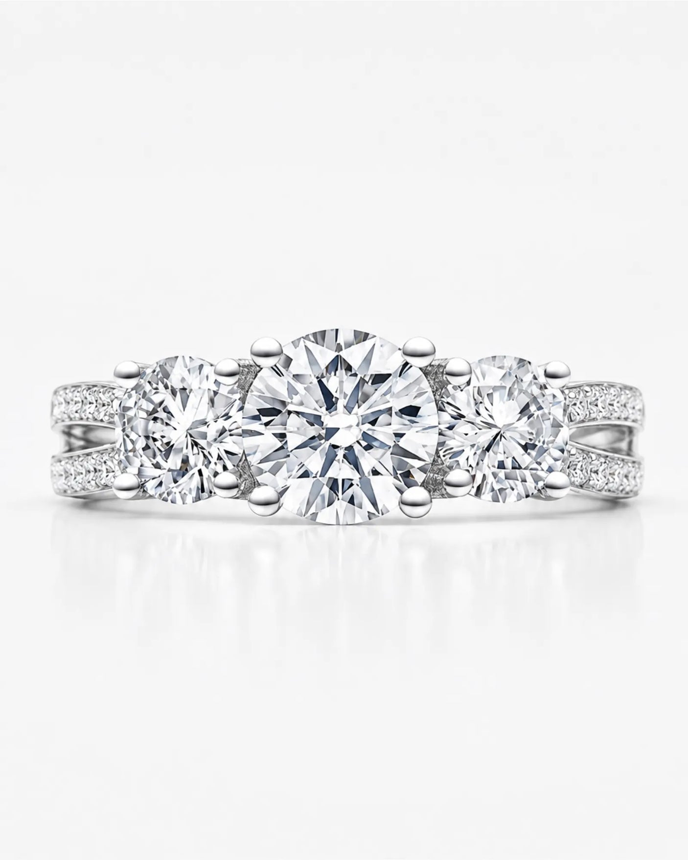 Luxury round moissanite split-shank ring with pavé shoulders in polished 18K white gold | SARATTI