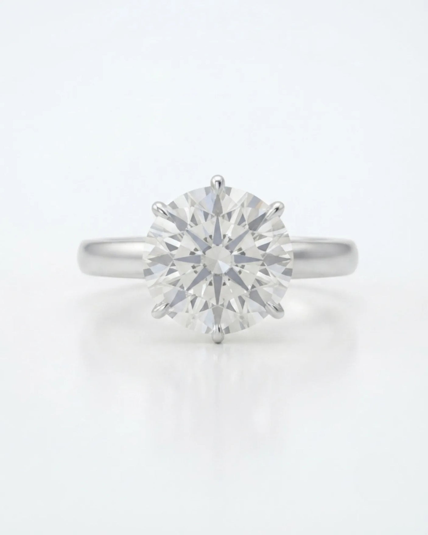 Luxury round moissanite statement ring with high-polish platinum band and elevated setting | SARATTI