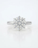 Luxury round moissanite statement ring with high-polish platinum band and elevated setting | SARATTI