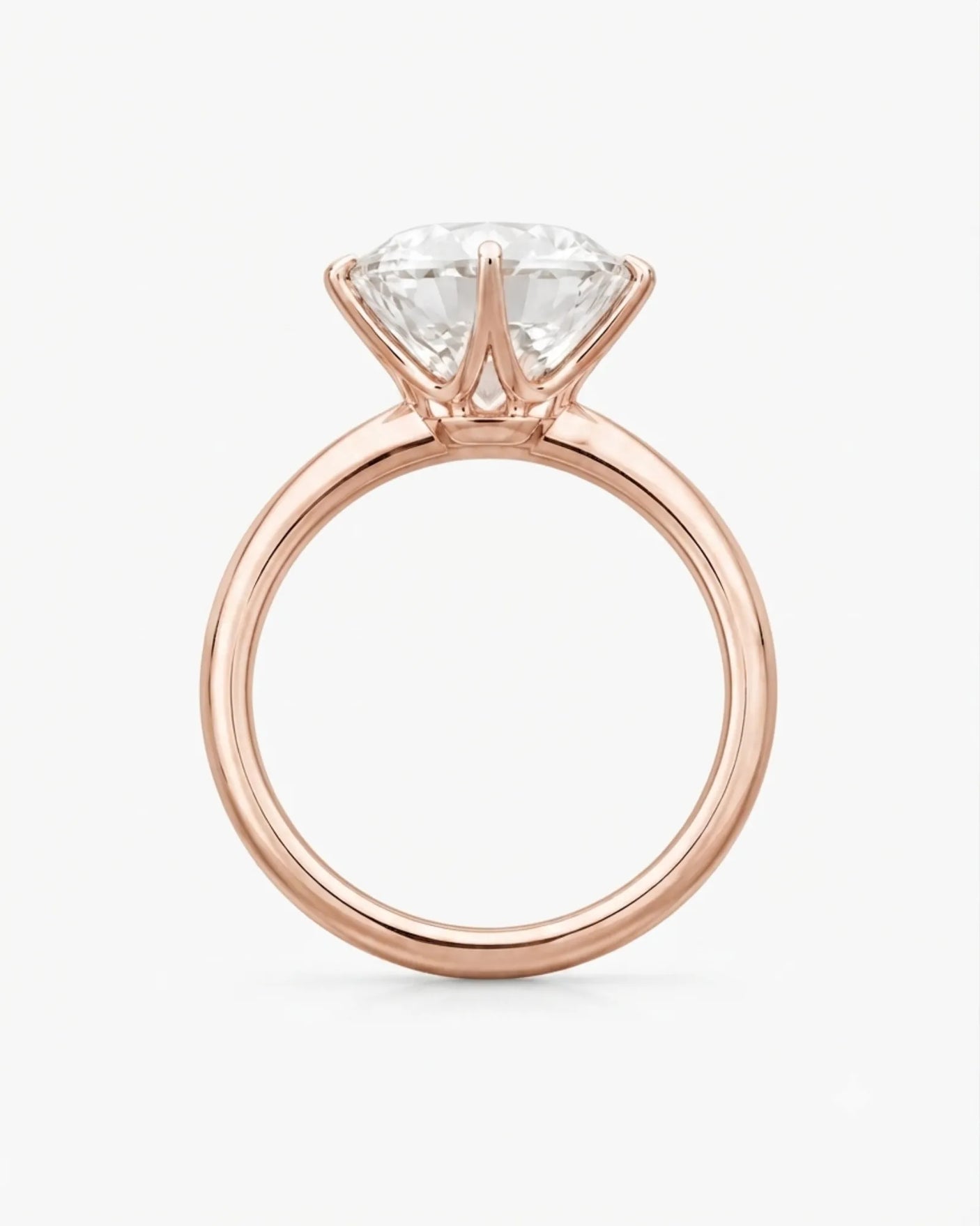 Luxury round moissanite statement ring with high-polish rose gold band and elevated setting | SARATTI.