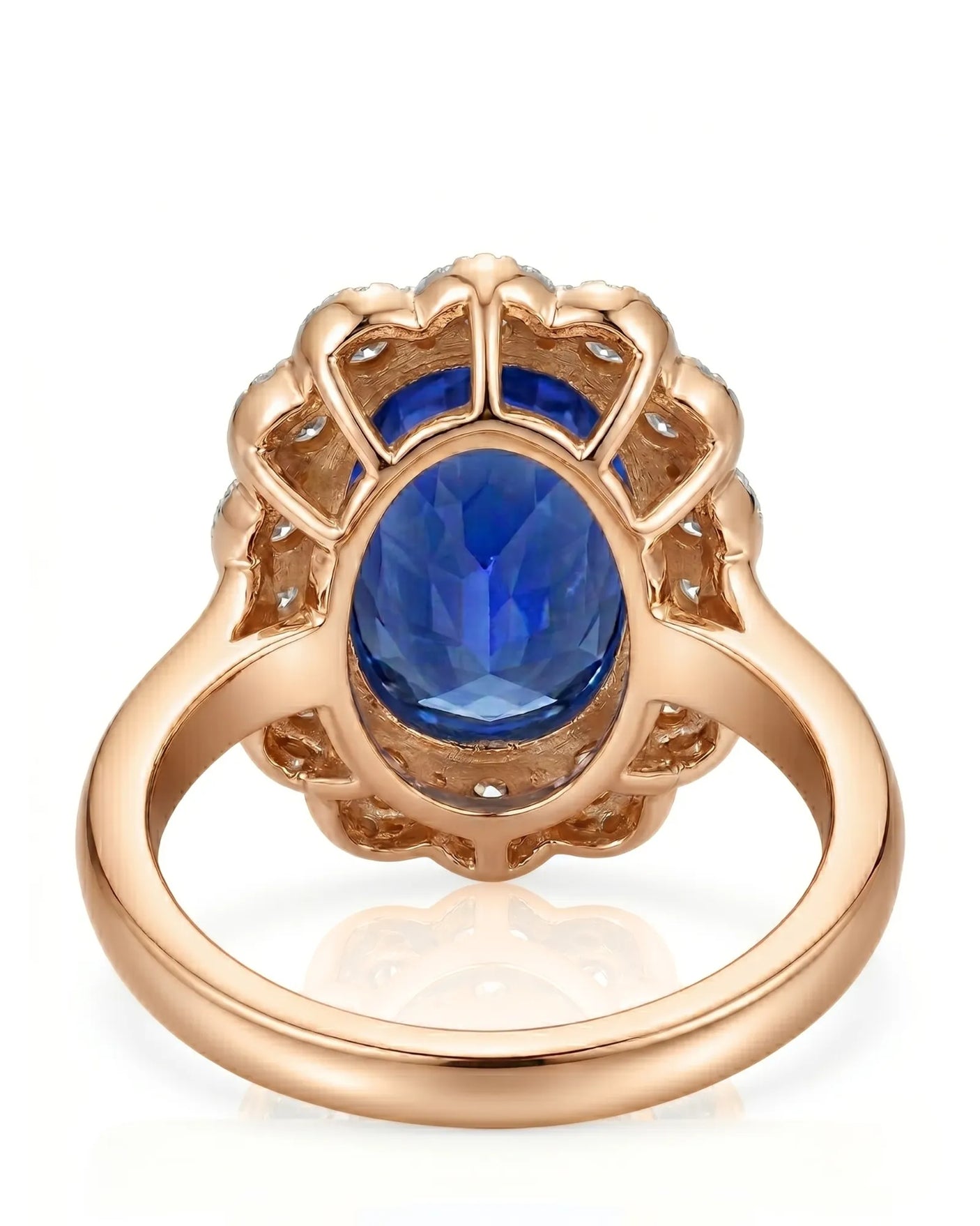 Luxury royal blue sapphire cocktail ring with diamond halo in 18K rose gold | SARATTI