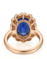 Luxury royal blue sapphire cocktail ring with diamond halo in 18K rose gold | SARATTI