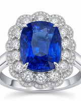 Luxury royal blue sapphire cocktail ring with diamond halo in 18K white gold | SARATTI