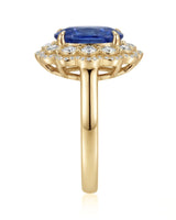 Luxury royal blue sapphire cocktail ring with diamond halo in 18K yellow gold - SARATTI