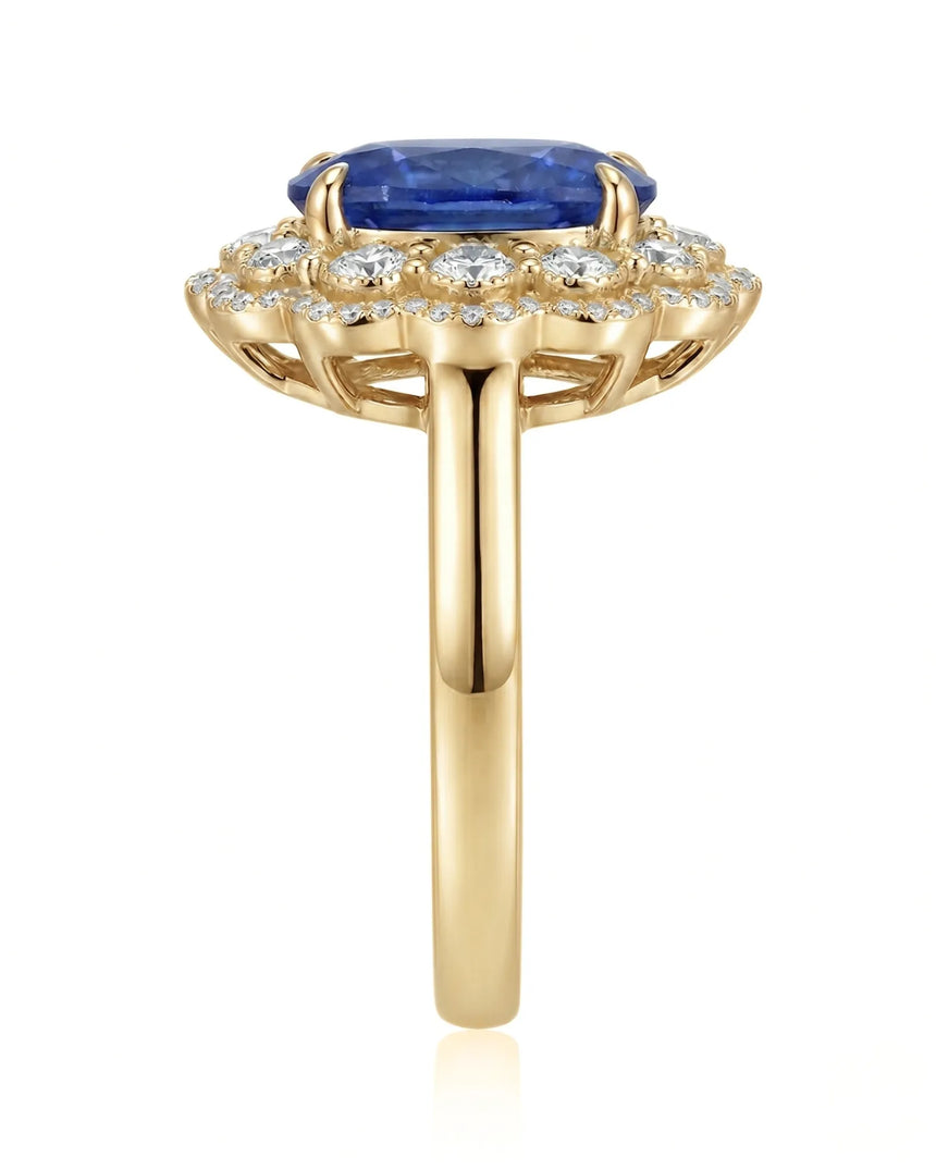Luxury royal blue sapphire cocktail ring with diamond halo in 18K yellow gold - SARATTI