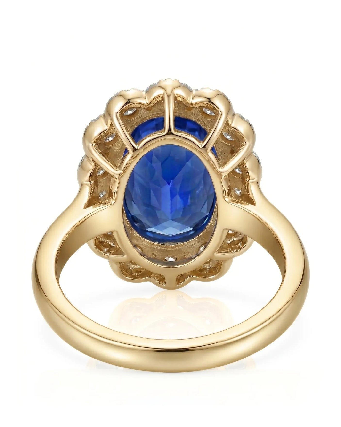 Luxury royal blue sapphire cocktail ring with diamond halo in 18K yellow gold | SARATTI