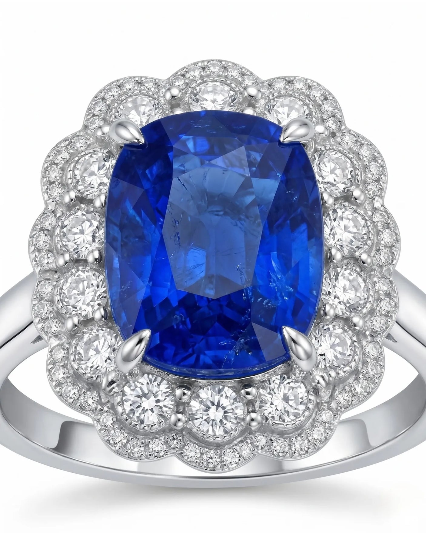 Luxury royal blue sapphire cocktail ring with diamond halo in platinum | SARATTI
