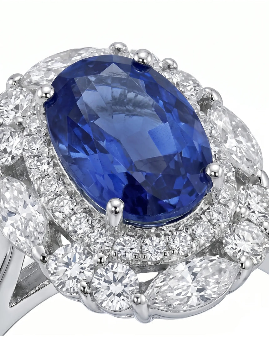 Luxury royal blue sapphire diamond ring with classic halo design in 18K white gold | SARATTI