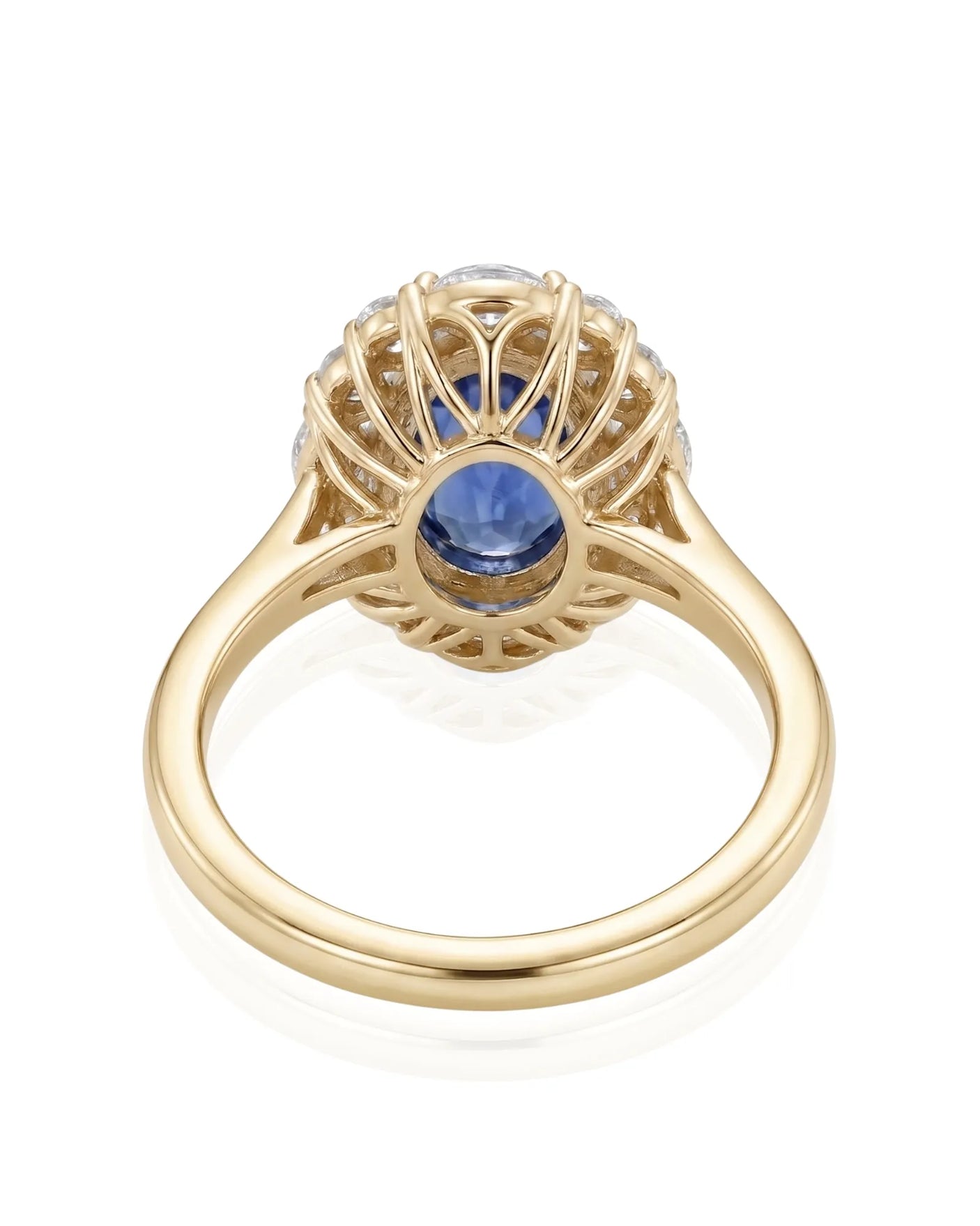 Luxury royal blue sapphire diamond ring with warm gold halo design in 18K yellow gold - SARATTI