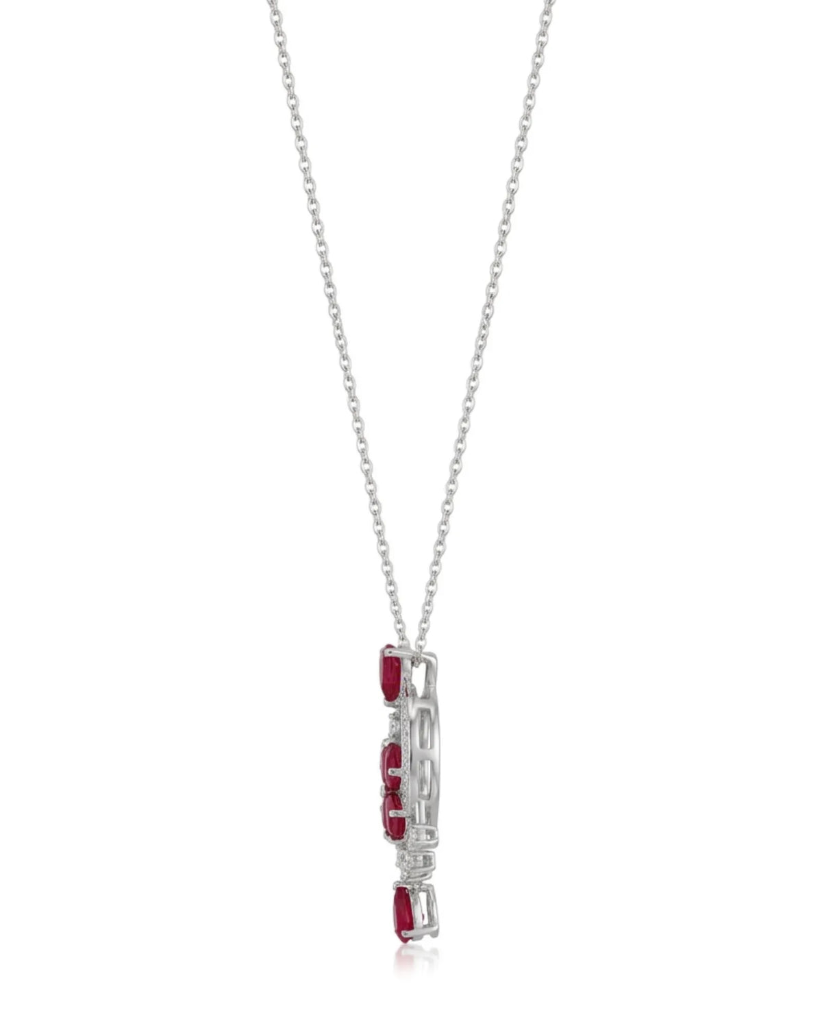 Luxury ruby dreamcatcher pendant styled with elegant neutral clothing | SARATTI
