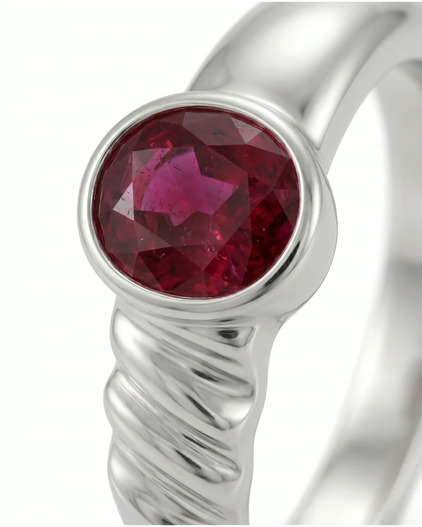 Luxury ruby solitaire ring in 18K white gold with contemporary sculpted shoulder detail | SARATTI