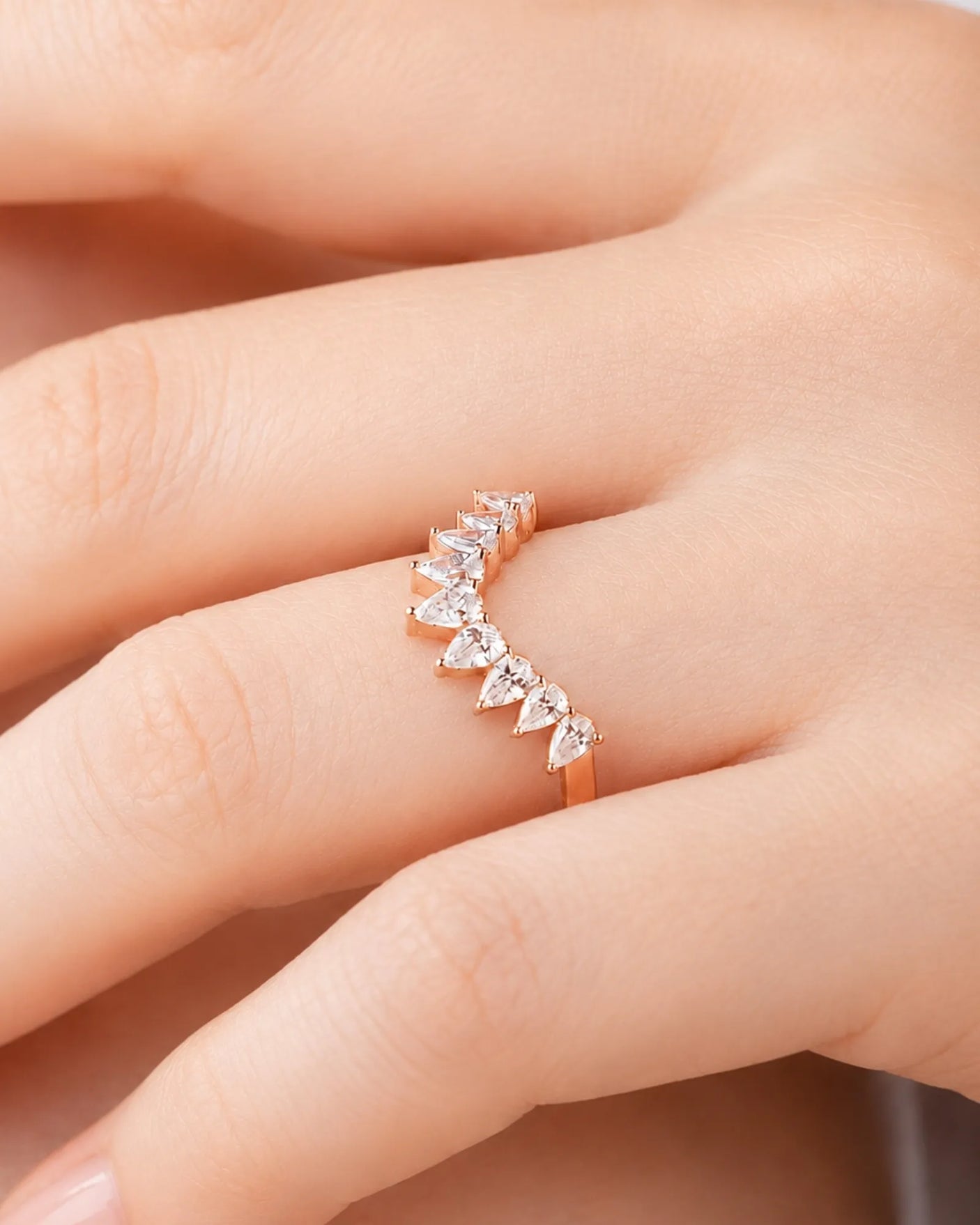 Luxury tiara-inspired half-eternity wedding ring with pear-shaped diamonds and polished 18K rose gold craftsmanship | SARATTI