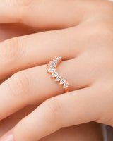 Luxury tiara-inspired half-eternity wedding ring with pear-shaped diamonds and polished 18K rose gold craftsmanship | SARATTI
