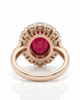 Luxury vintage ruby halo ring with diamond accents in polished rose gold | SARATTI