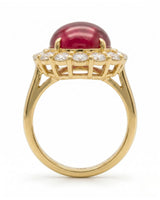Luxury vintage ruby halo ring with diamond accents in polished yellow gold | SARATTI