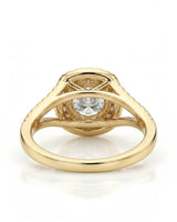 Luxury yellow gold halo bridal set with round moissanite center and seamless curved wedding band | SARATTI.