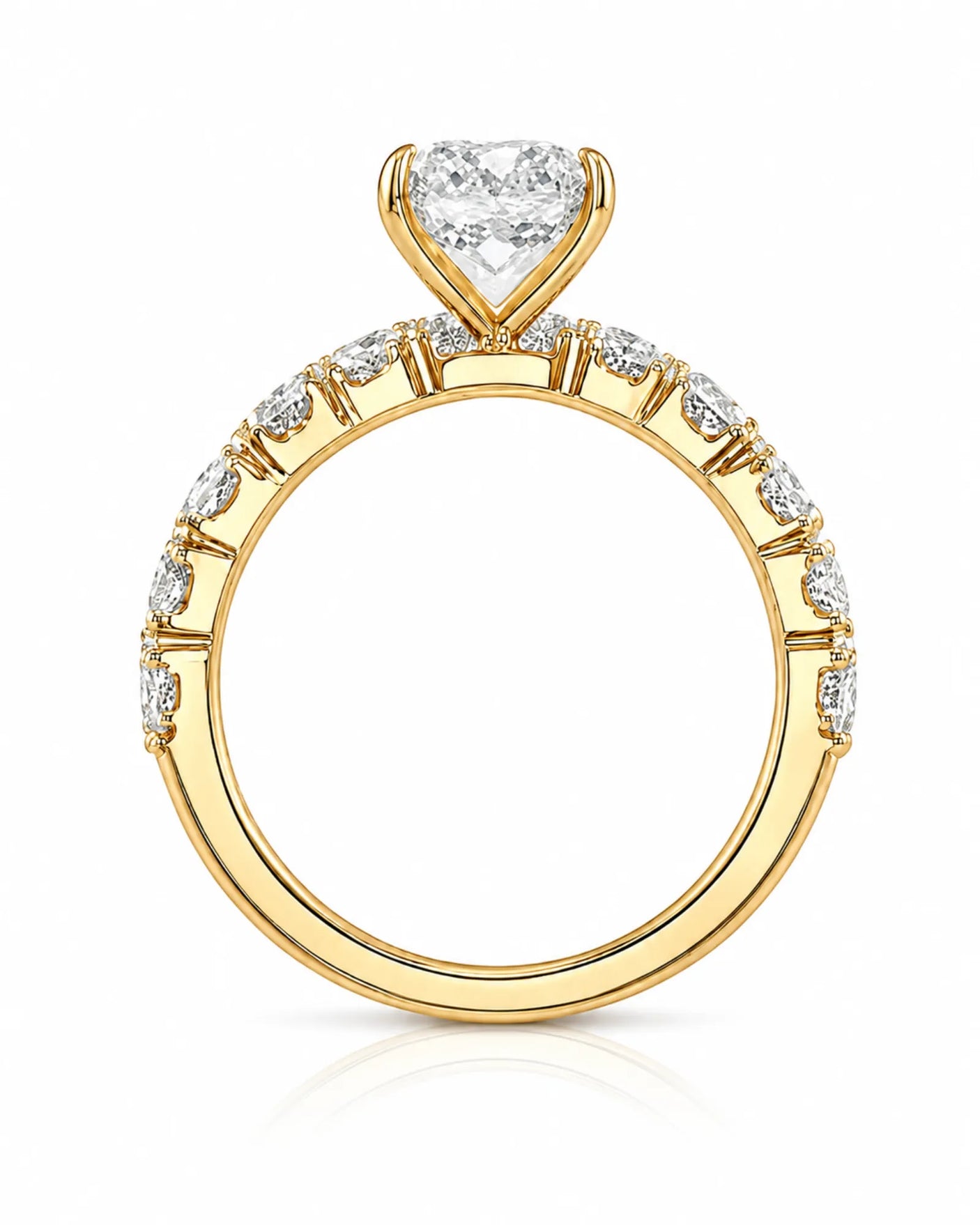 Luxury yellow gold pear cut moissanite ring with luminous side stones and elegant balance | SARATTI