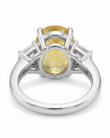 Luxury yellow sapphire three-stone ring with diamond accents in polished platinum - SARATTI