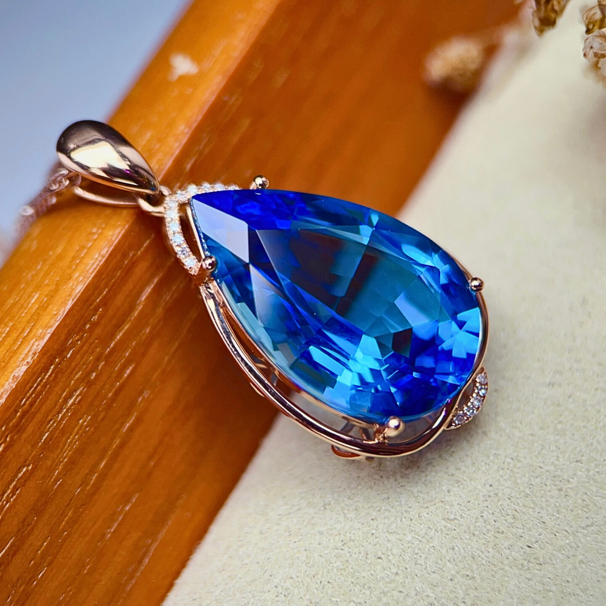 Elegant rose gold and diamond accented topaz pendant