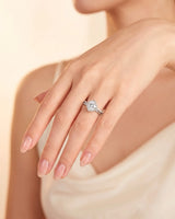 Renea – Majestic Grace Natural Round Diamond Two-Tone Halo Ring