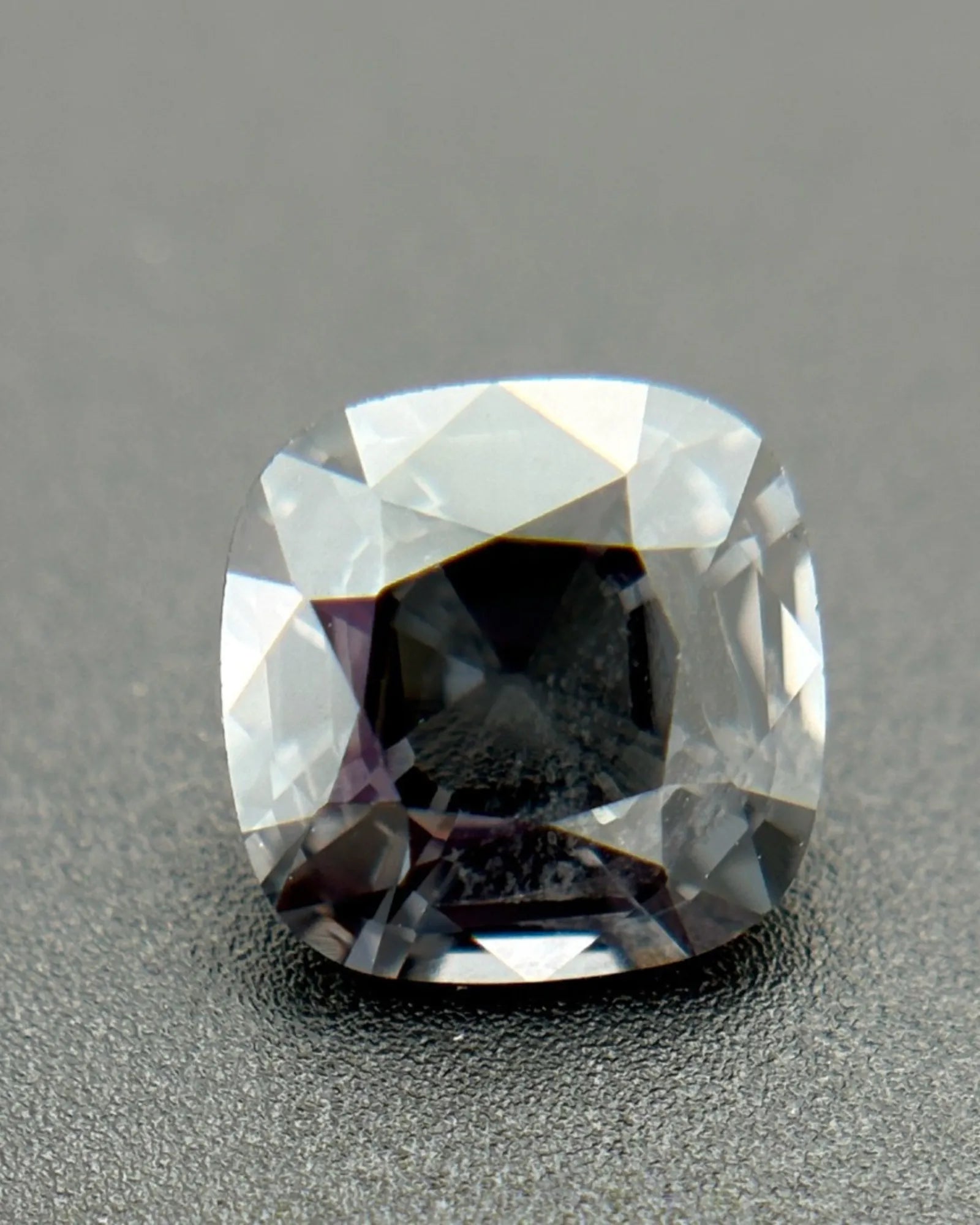 Metallic Gray Spinel cushion top view with broad facets | SARATTI