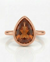 Minimal Build My Ring Topaz solitaire with smooth rose gold bezel | SARATTI