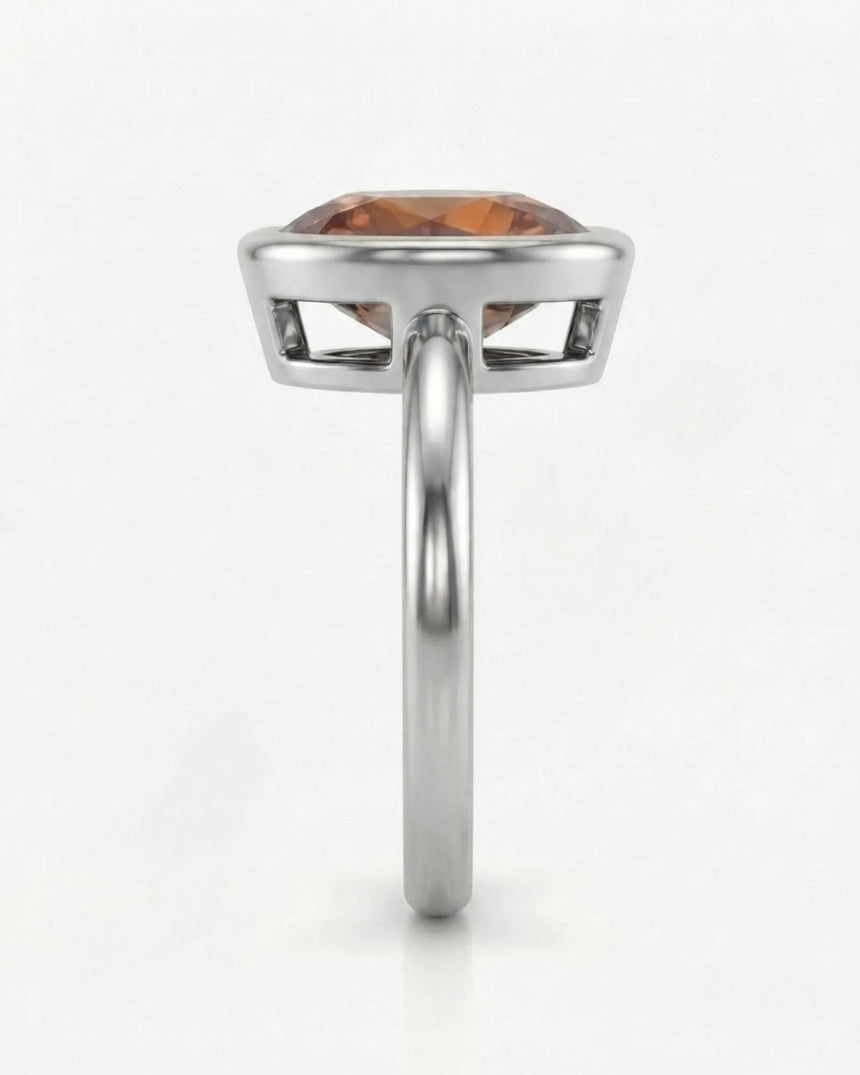 Minimal Natural Imperial Topaz solitaire with continuous platinum bezel | SARATTI