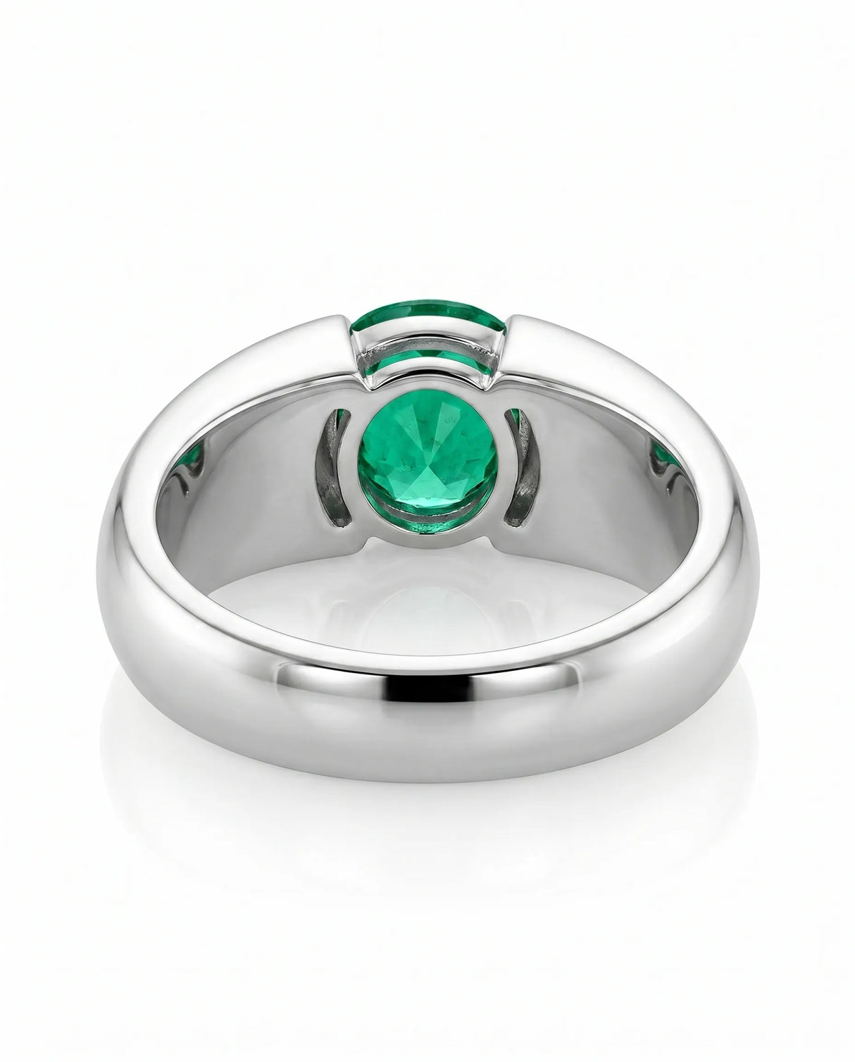 Minimal emerald statement ring in platinum | SARATTI
