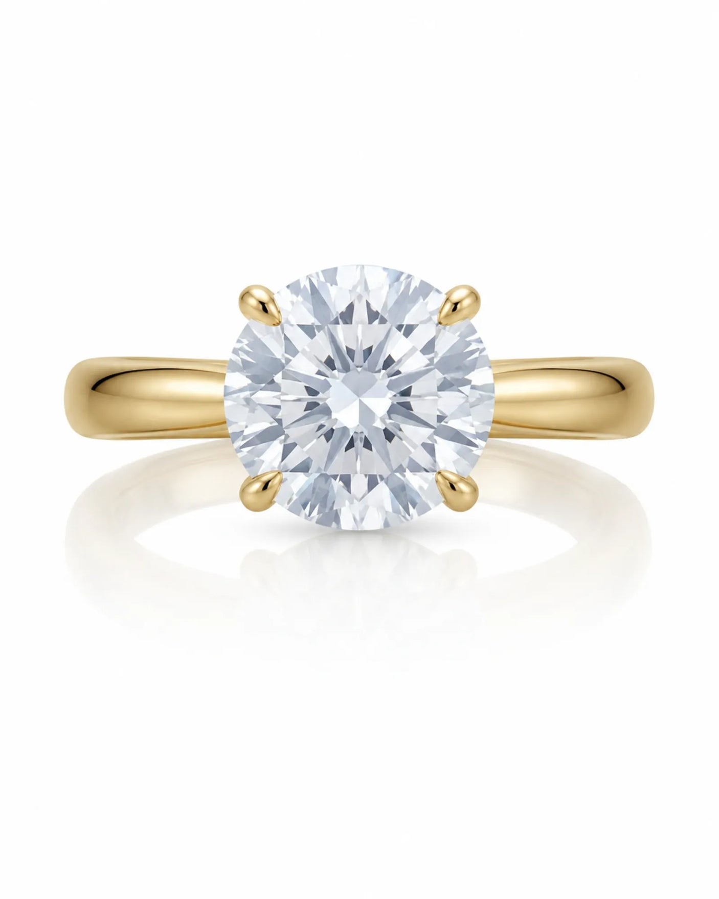 Minimal round moissanite ring with sculptural floral setting and polished yellow gold band | SARATTI