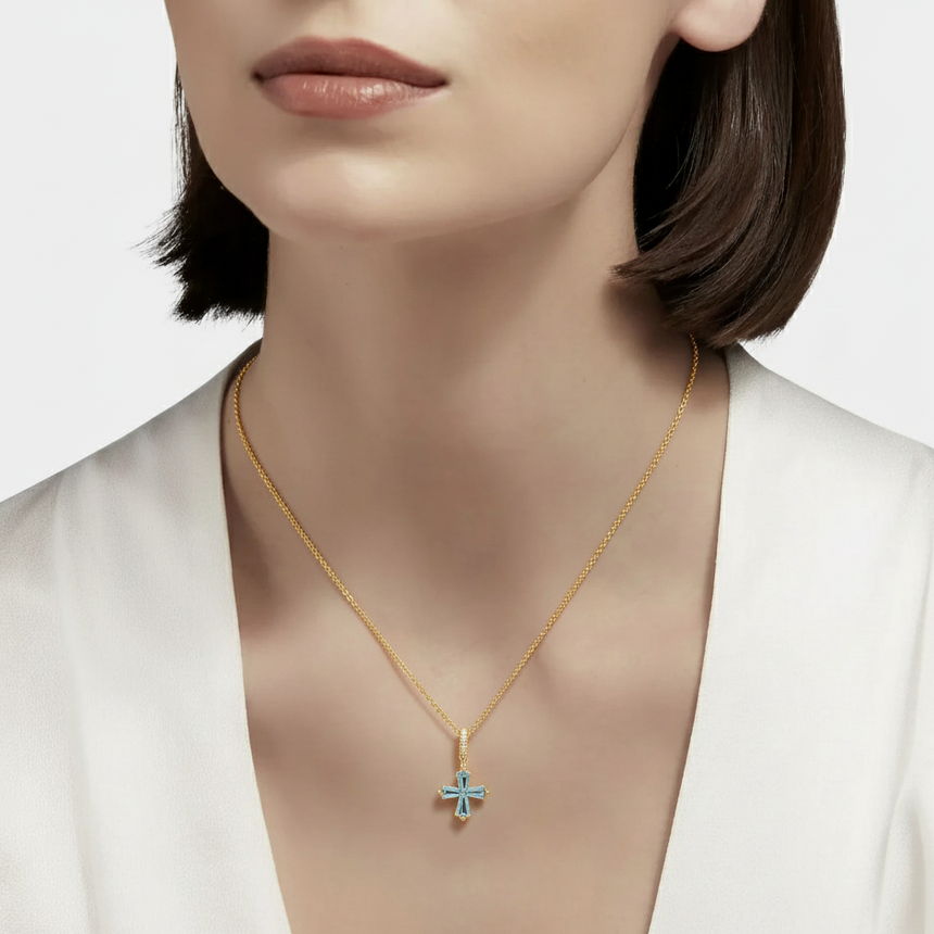 Model wearing the Celestial Cross Aquamarine Necklace in 18K Yellow Gold – SARATTI