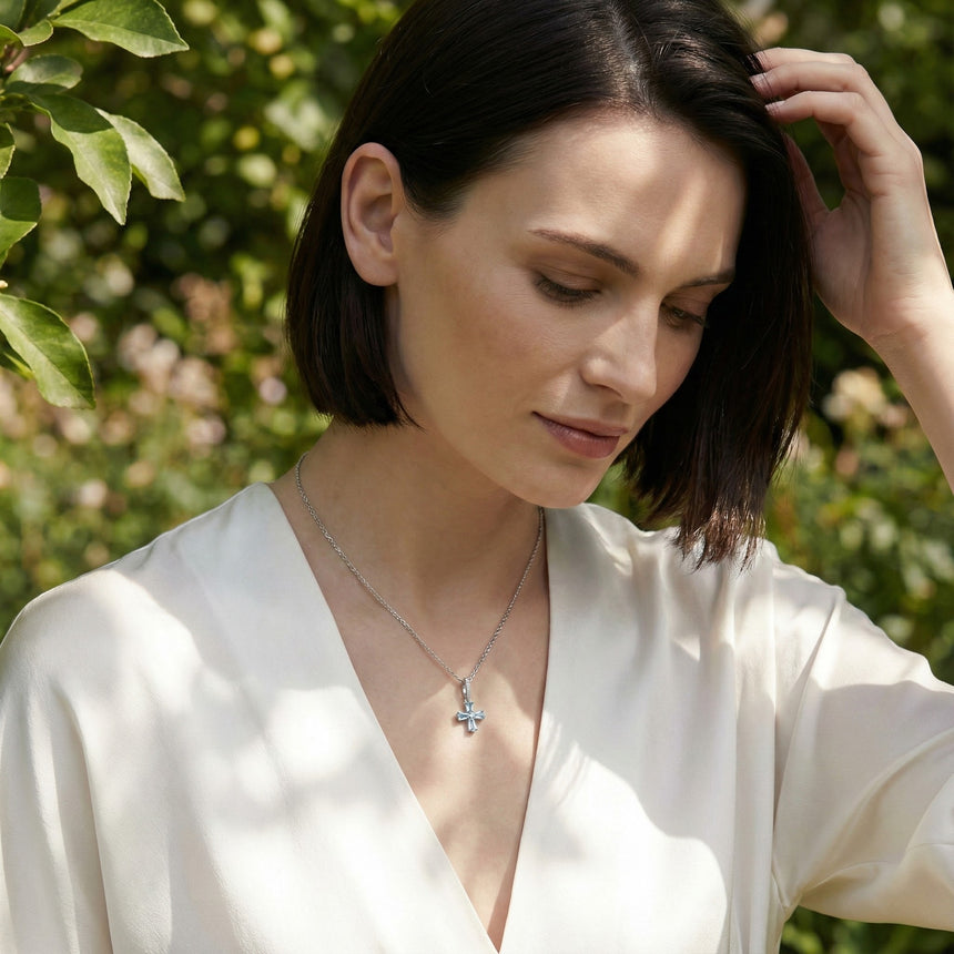 Model wearing the Celestial Cross Aquamarine Necklace in Platinum – SARATTI