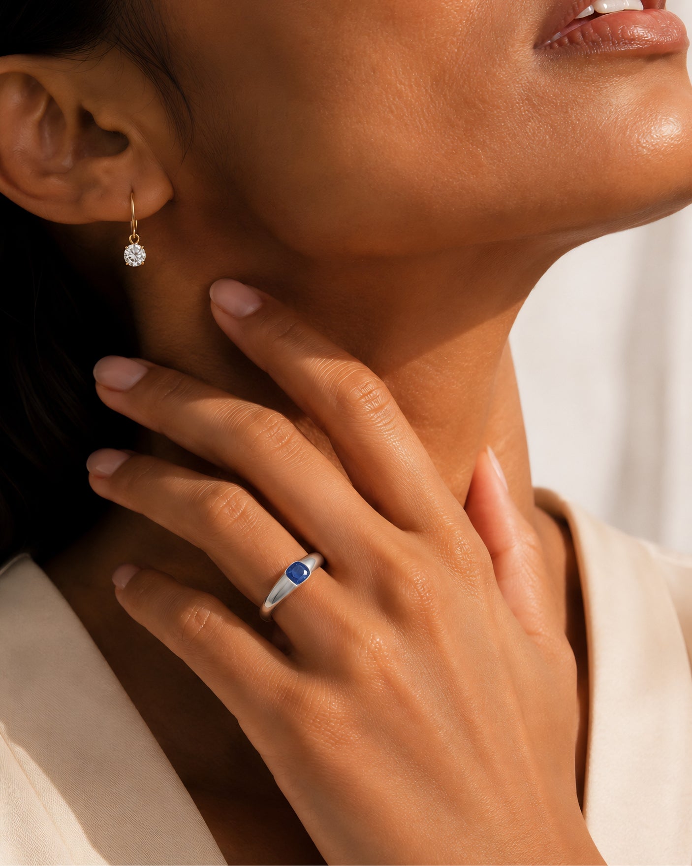 Modern cushion sapphire ring with smooth tension setting and polished 18K white gold band | SARATTI