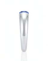 Modern cushion sapphire ring with smooth tension setting and polished platinum band | SARATTI