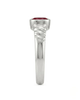 Modern platinum ruby ring with oval gemstone and triple wave shoulder detail | SARATTI