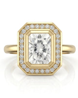 Modern radiant moissanite engagement ring with halo accents in polished 18K yellow gold | SARATTI