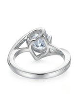 Modern round moissanite engagement ring with symbolic infinity design in 18K white gold | SARATTI