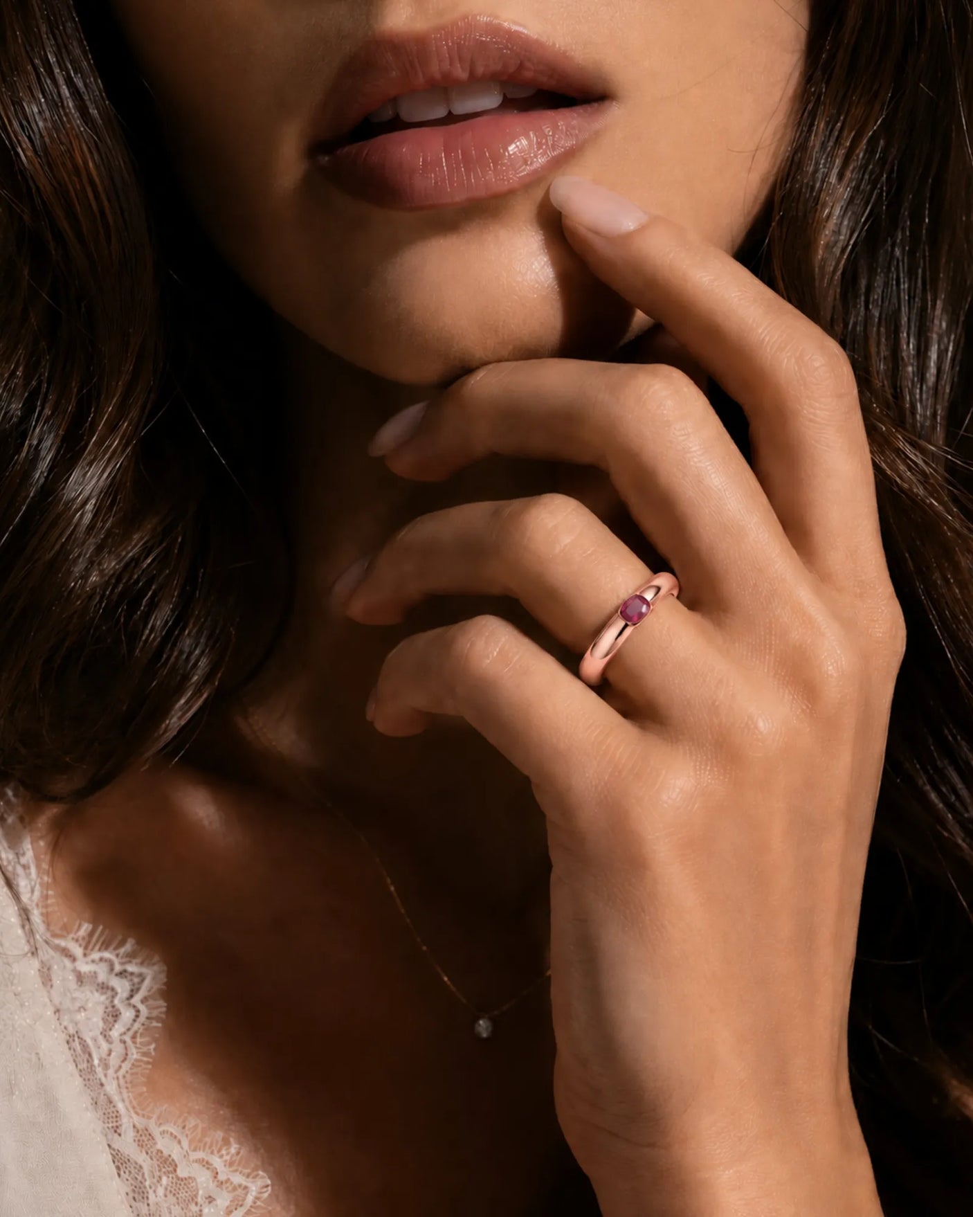 Modern ruby engagement ring with tension set center stone in 18K rose gold | SARATTI