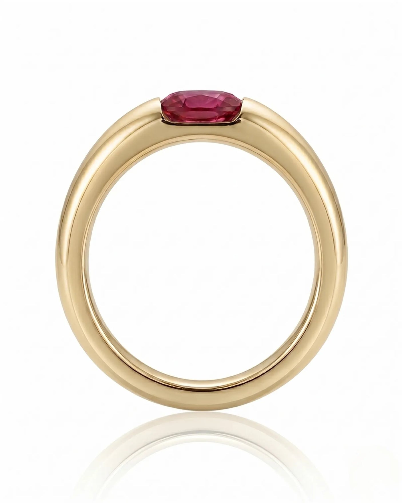 Modern ruby engagement ring with tension set center stone in 18K yellow gold | SARATTI
